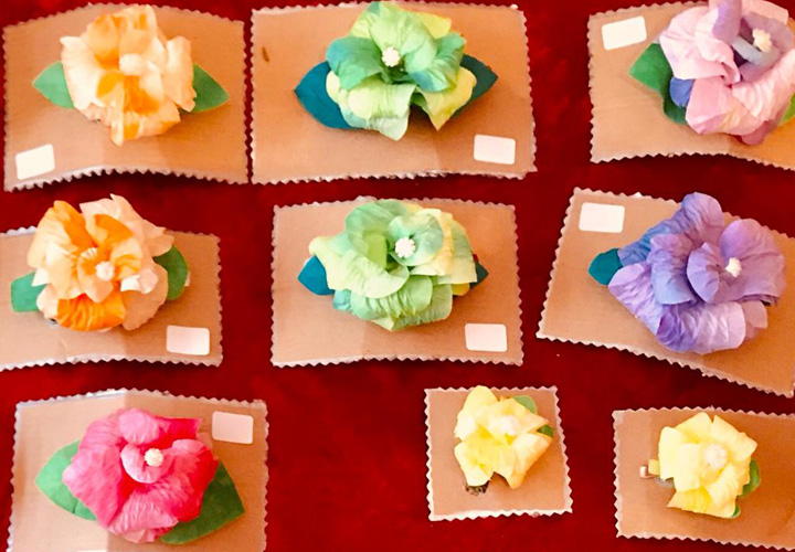 Used Coffee filters can be wash, painted, cut and glued to form flower hair pins.